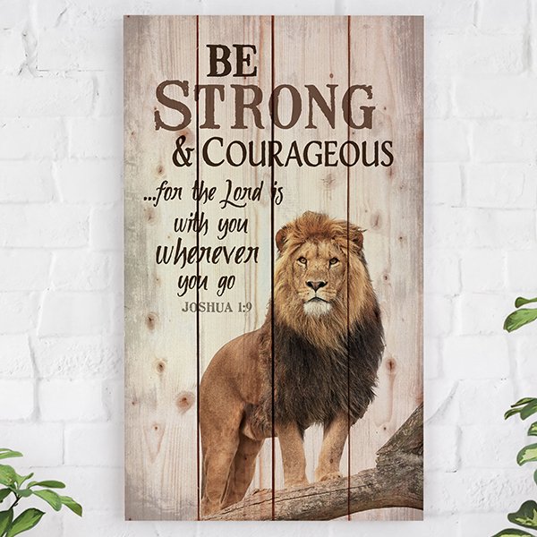 Rustic wooden wall art featuring a lion's face and the text 'Be strong & take courage...for the Lord is with you wherever you go. Joshua 1:9' on whitewashed vertical pallet slats.