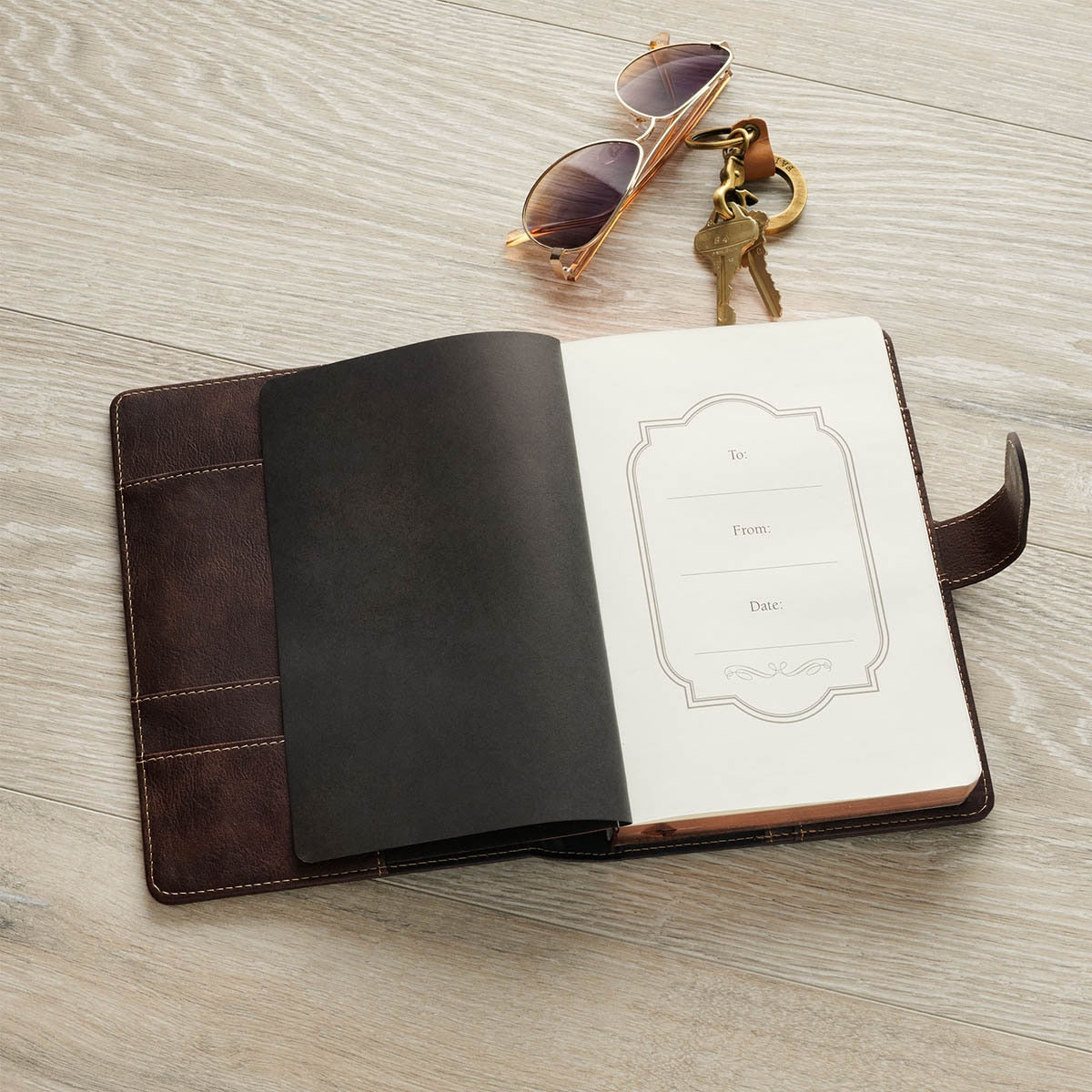 Man of God magnetic journal cover open to its included notebook and interior pockets