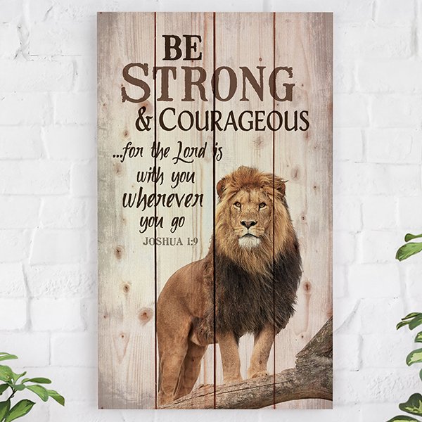 Rustic wooden wall art featuring a lion's face and the text 'Be strong & take courage...for the Lord is with you wherever you go. Joshua 1:9' on whitewashed vertical pallet slats. 