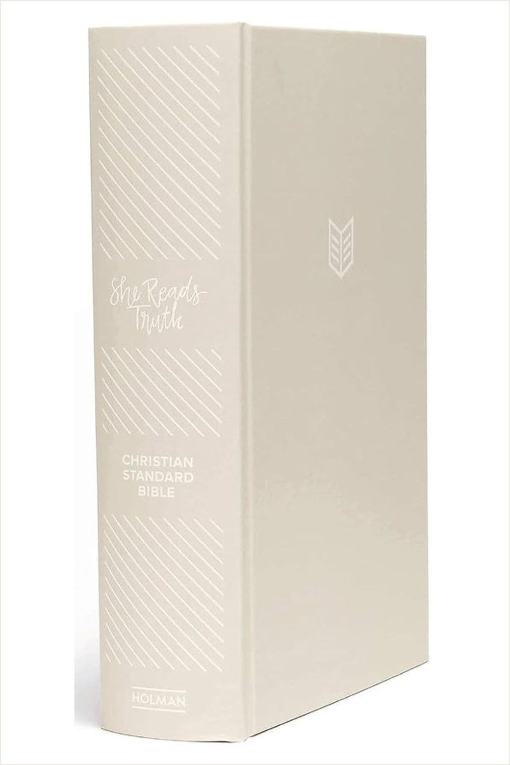 Three-quarter view of the light beige linen CSB She Reads Truth Bible, showing its spine, cloth cover and debossed lettering.